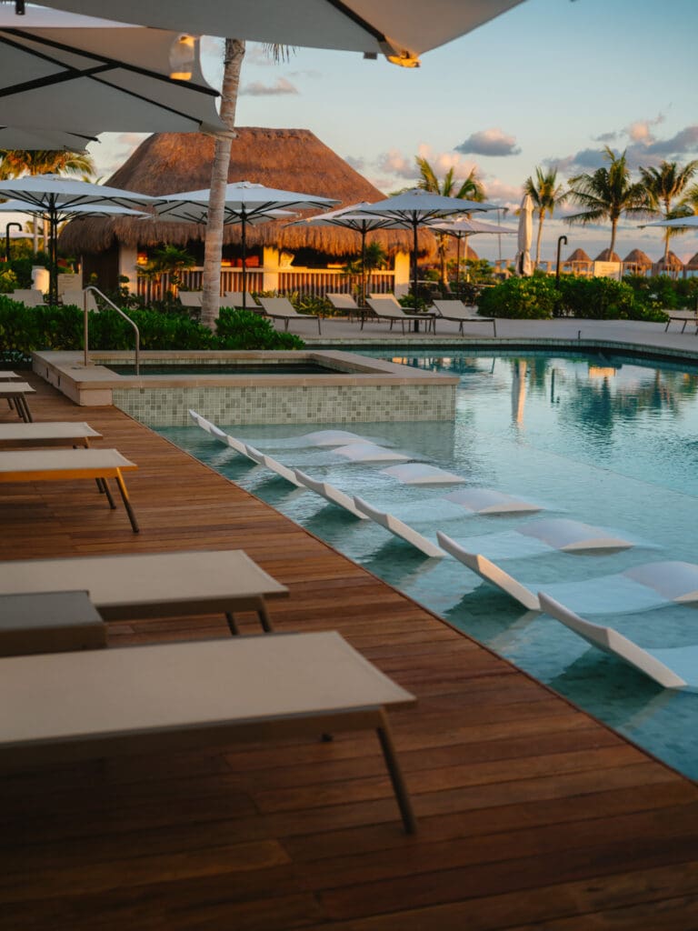 Hospitality photography capturing pools and water design at Playa Mujeres resort