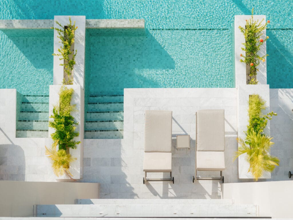 Hospitality photography capturing pools and water design at Playa Mujeres resort