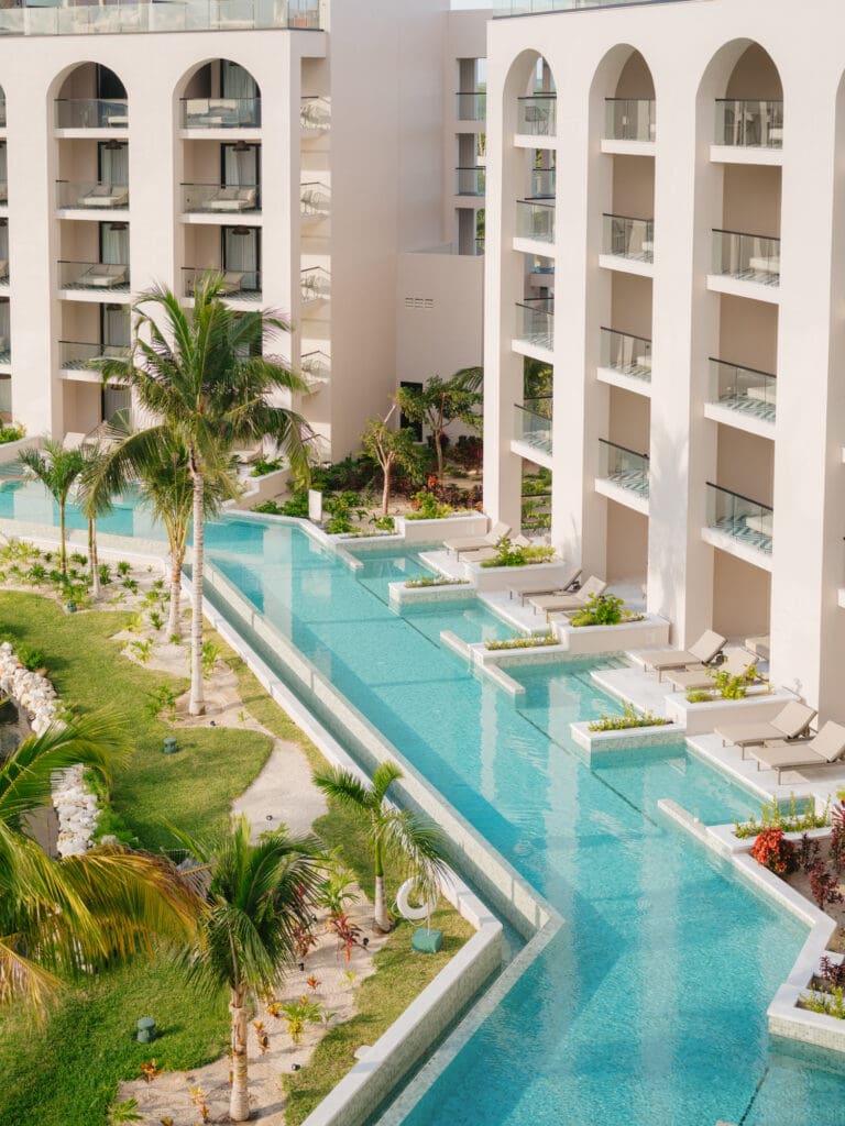 Hospitality photography capturing pools and water design at Playa Mujeres resort