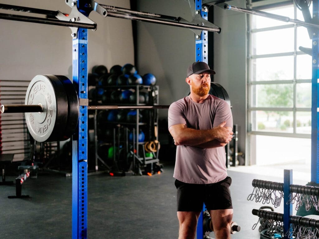 trainer with kettlebell (CrossFit NWA) Lululemon trainer racking a kettlebell at CrossFit NWA, fitness brand photography