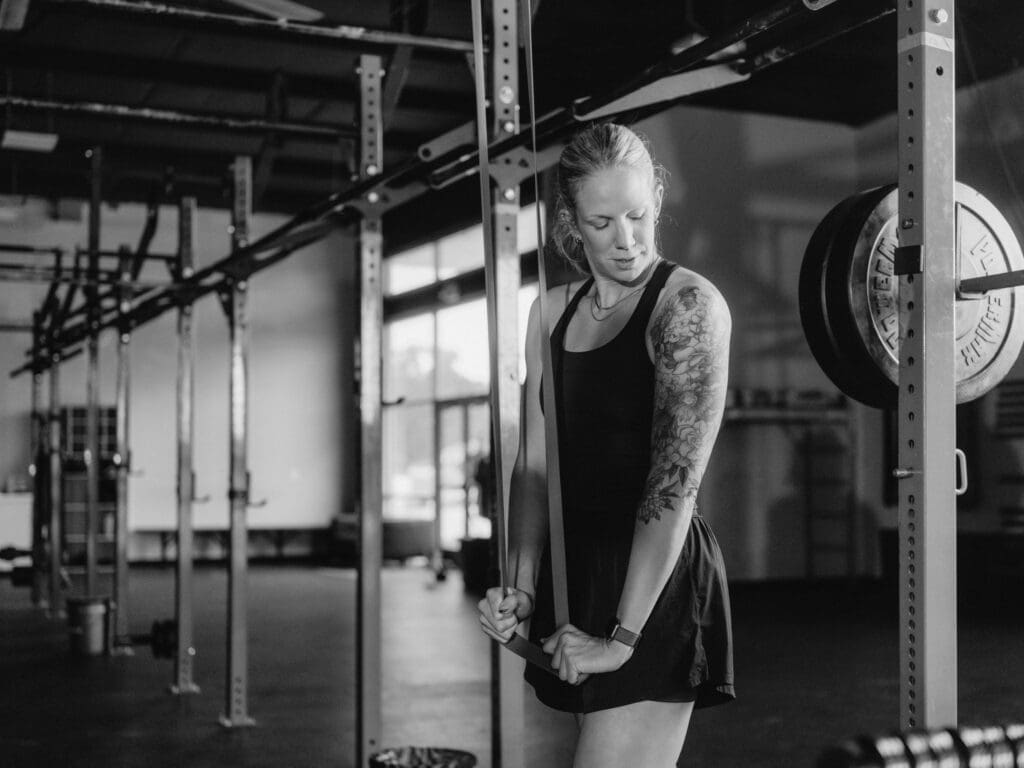 trainer seated (CrossFit NWA) Lululemon trainer between sets at CrossFit NWA, brand photographer Northwest Arkansas