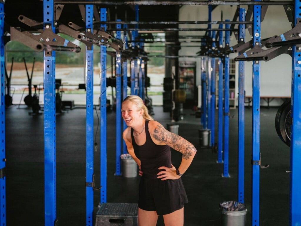 trainer seated (CrossFit NWA) Lululemon trainer between sets at CrossFit NWA, brand photographer Northwest Arkansas